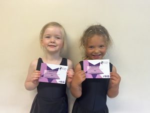 Young dancers age 5 years primary school age receiving certificates for their dancing in Richmond North Yorkshire